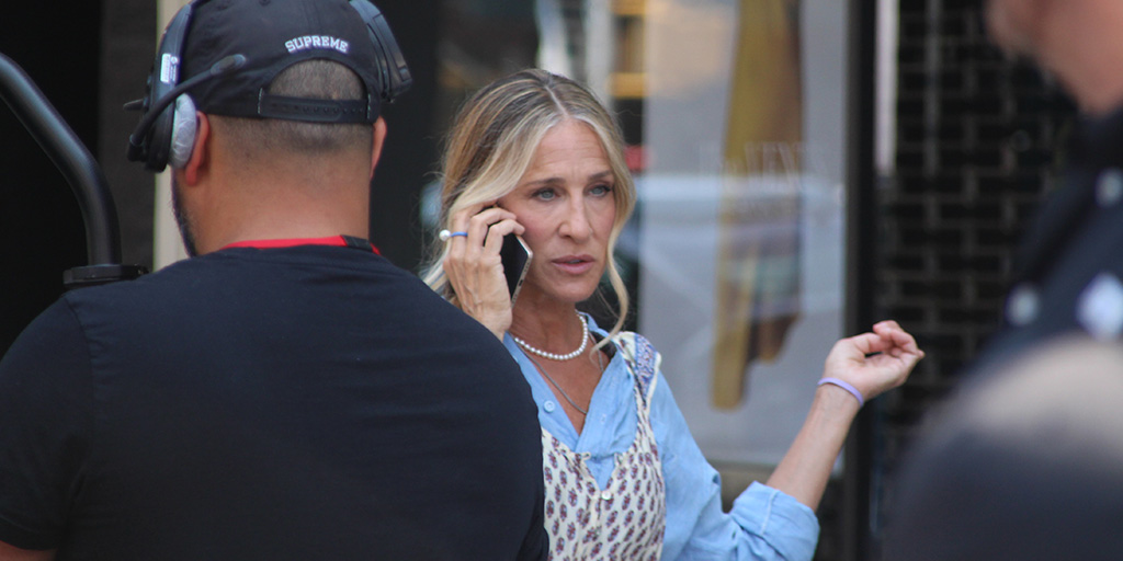 Sarah Jessica Parker shooting a scene on a sidewalk along Amsterdam Avenue