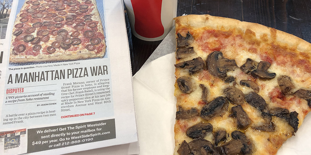 A copy of the West Side Spirit and slice of the good stuff at Made In New York Pizza.