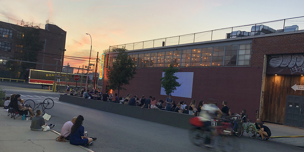 Movie goers are socially distanced while waiting for the movie to start on the wall at Syndicated BK. August 22, 2020