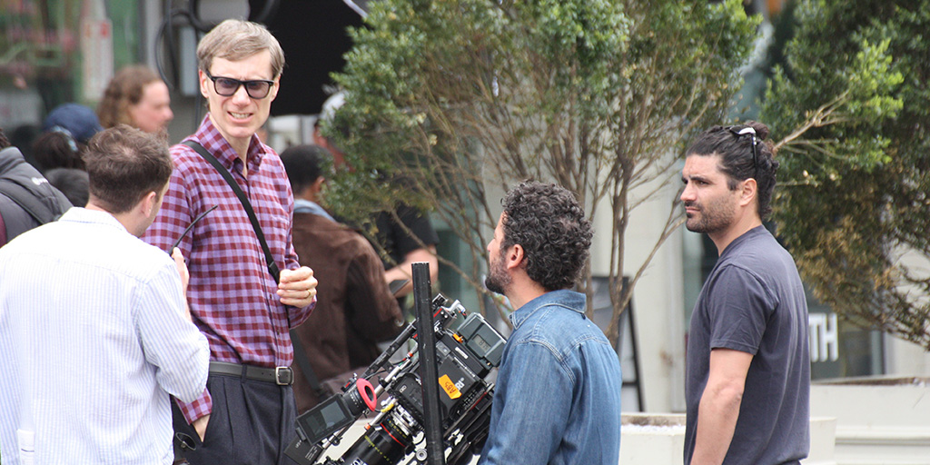 Stephen Merchant talking with crew