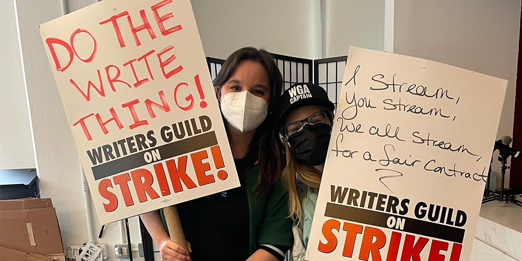 WGAe workers preparing for an imminent strike by making picket signs.